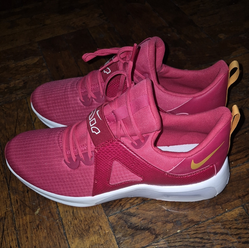 Nike Women's Pink Training Sneakers with Gold Swoosh